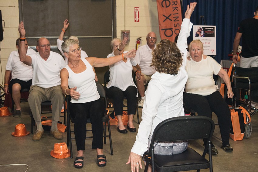 Participants demonstrate how body movement exercises can help Parkinson' symptoms.