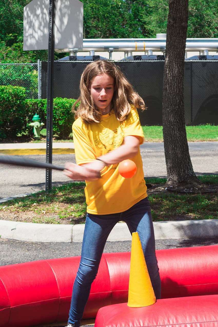 Izzy McCloskey attempts a winning hit.