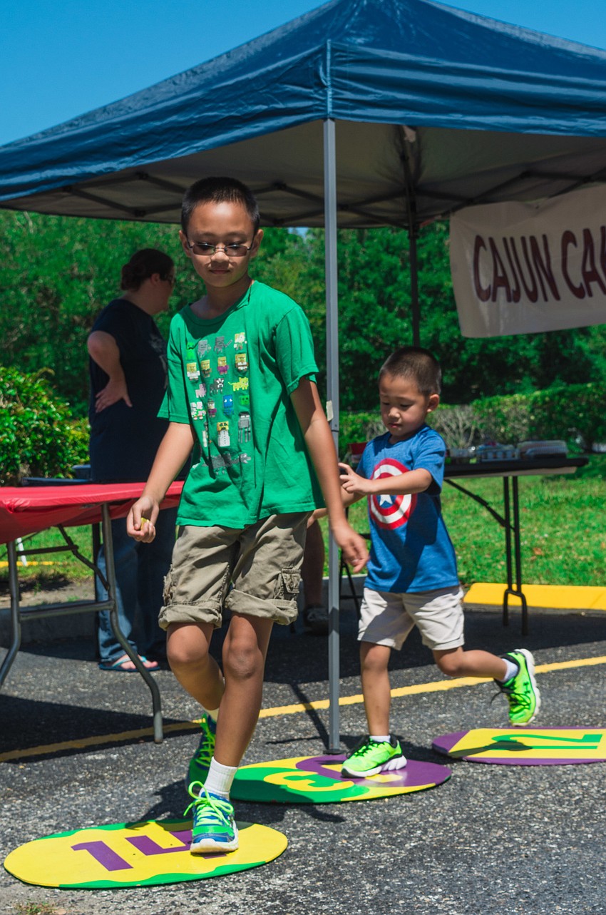 Jacob and Lucas Mai try to win cupcakes during the cake walk.