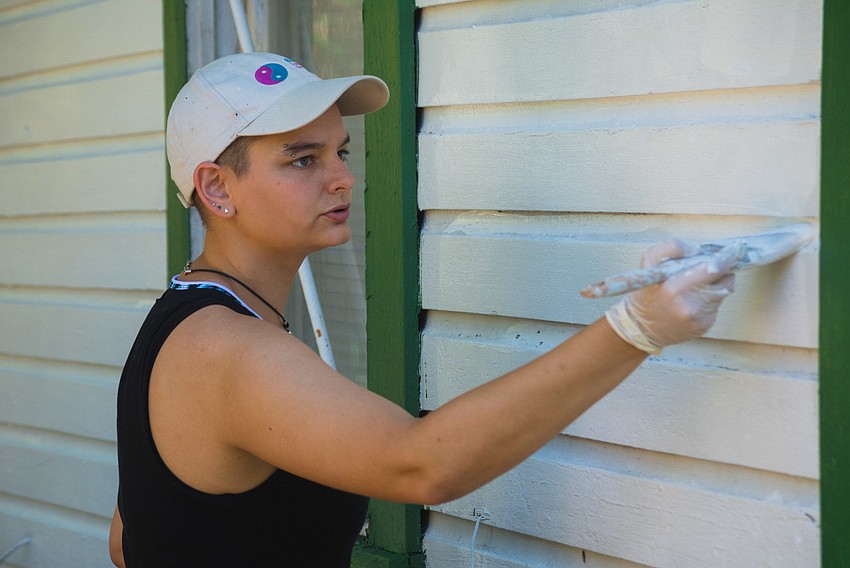 Rachel Pick volunteers her time to paint a Newtown landmark.