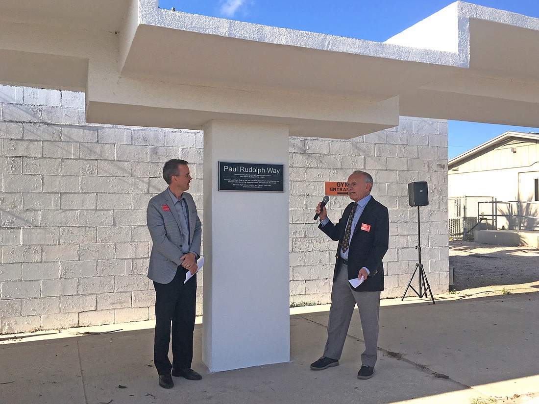 Sarasota Architectural Foundation Board of Directors chair Christopher Wilson and board member Michael Kalman unveil a plaque honoring Paul Rudolph.