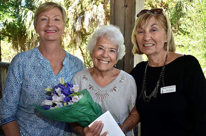 Annual Meeting Co-chairwomen Janice Cook, Beverly Shapiro, who was recognized for her dedication the club, and Jinny Johnson