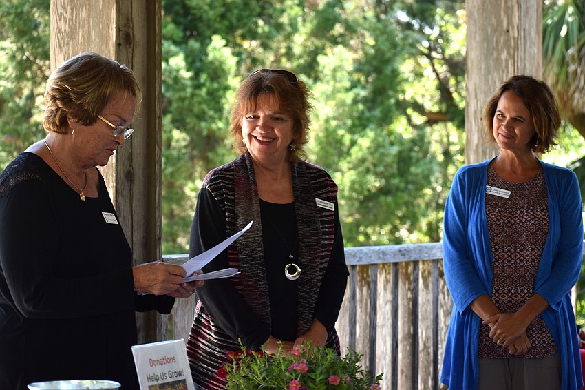 Grant Chairwoman Emmy Lou Gilbert introduces Kevan Main and Laura Shoemaker  of grant recipient Mote Marine Laboratory and Aquarium.