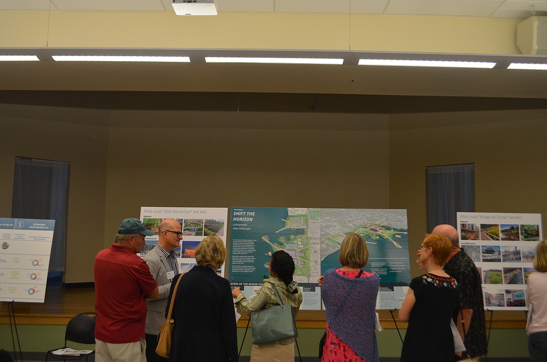 Attendees discuss the future of the bayfront at Tuesday&#39;s The Bay open house at the Robert L. Taylor Community Complex.