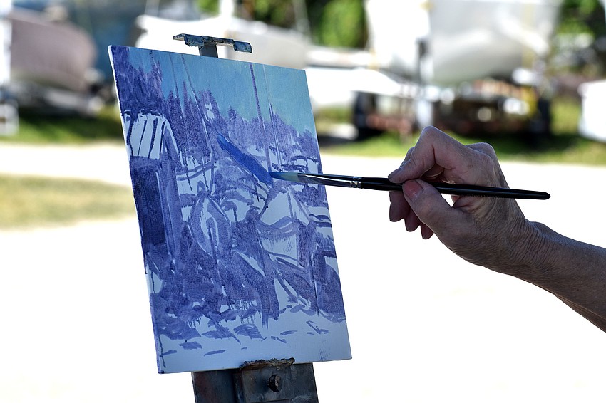 Diane Mannion replicates a boat sitting on the Sarasota Sailing Squadron property.