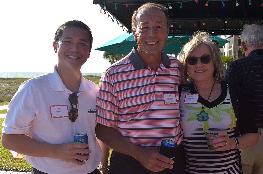 Eric Teoh and Jim and Anita Hudepohl