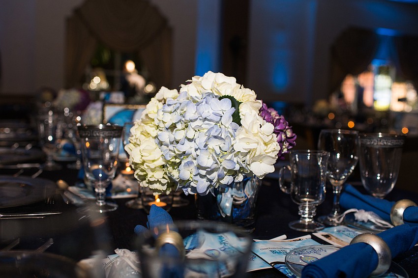 Hydrangeas in white, blue and purple adorned the tables.