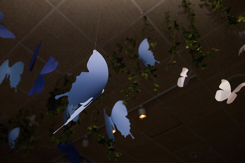 Butterflies were hanging from the ceiling.