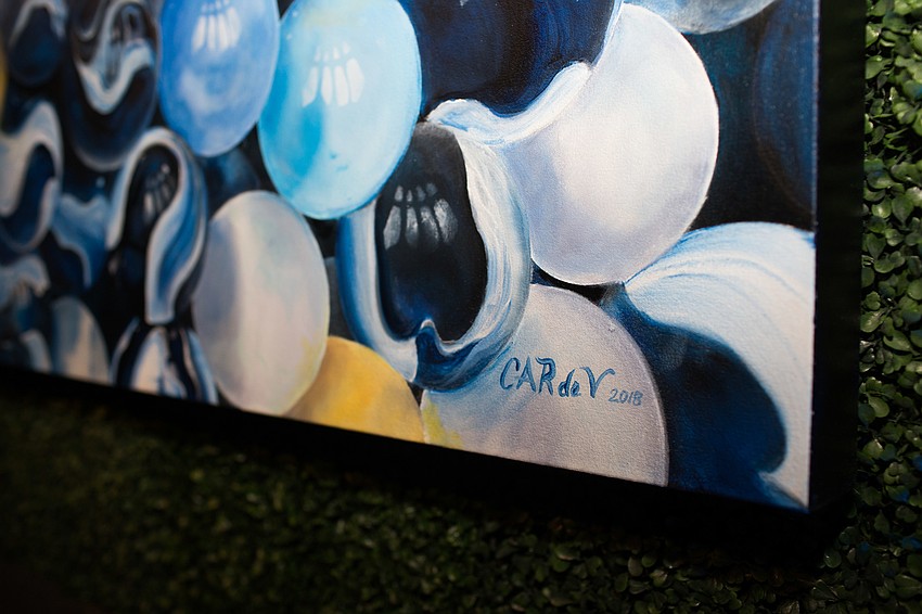 The painting was auctioned off at the end of the evening.