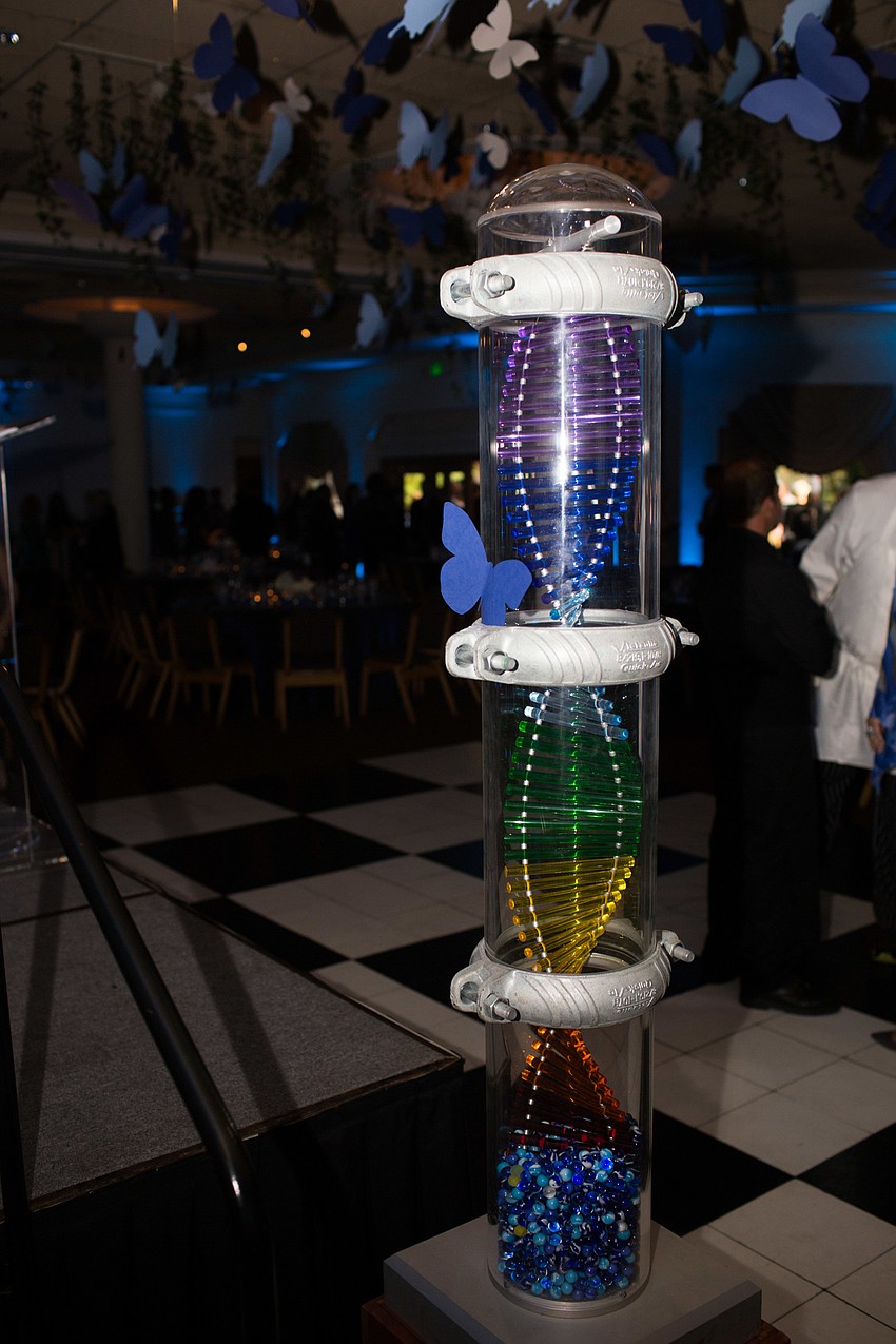 A mini pillar of hope, the symbol of Child Protection Center, sat at the front of the room.