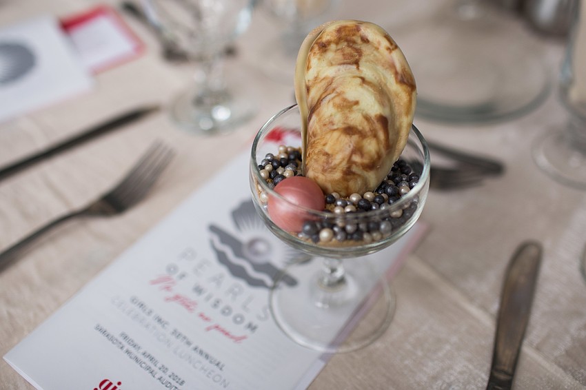 Dessert was a clamshell on sand with a pearl.