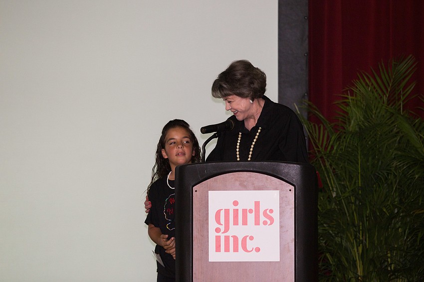 Honoree Susan Buck thanks a Girls Inc. member for the introduction.