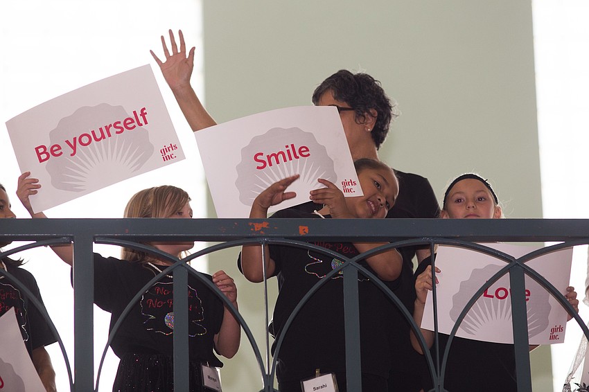 Each girl held up a sign with an inspiring word on it.