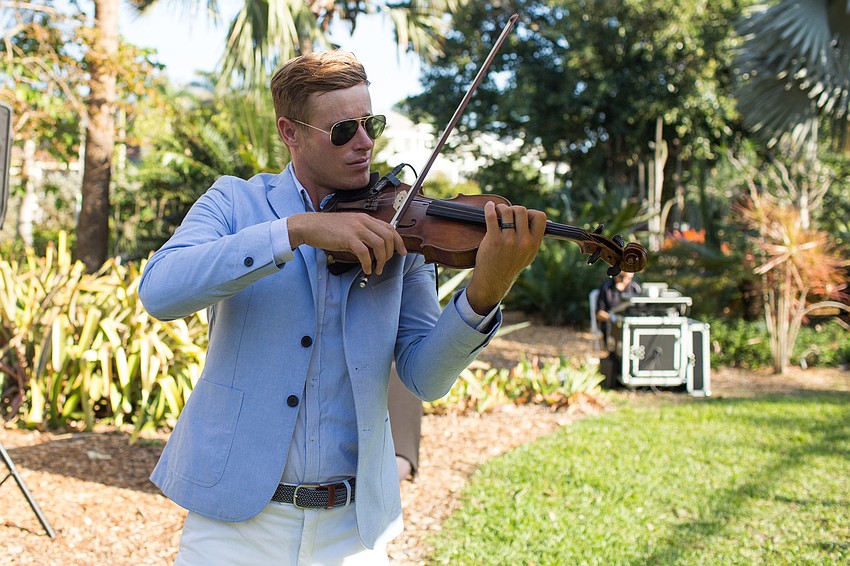 Cal Morris entertained guests with violin music.