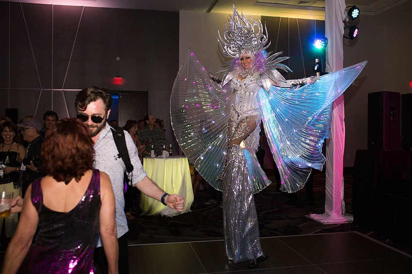 A dancer on stilts occupied the dance floor in the VIP ballroom.