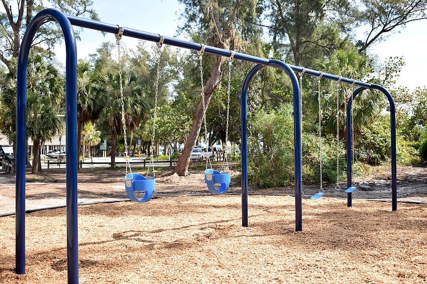 The new playground was built by numerous volunteers, including local firefighters.