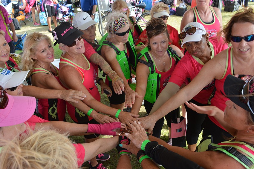 Survivors in Synch rowers meet after they won their semifinal heat.