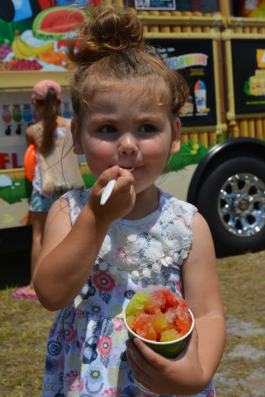Greenbrook's Kenna McSheery, 2, loves the park, but she loves her Kona Ice even more.