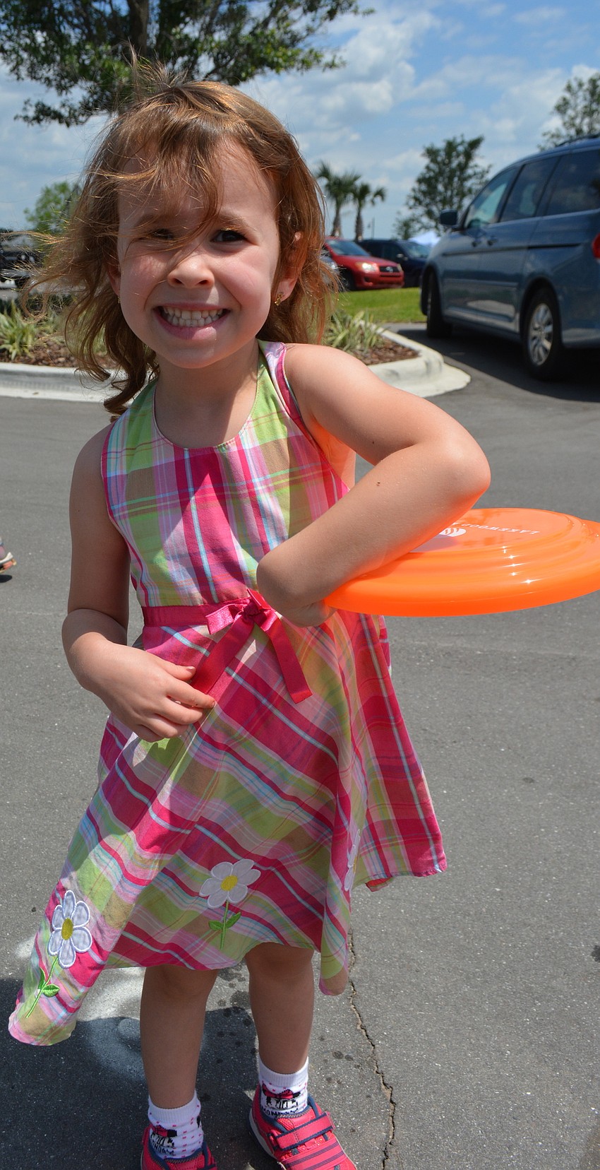 Lakewood Ranch's Isabelle Halpin received her first Frisbee when she entered the park.