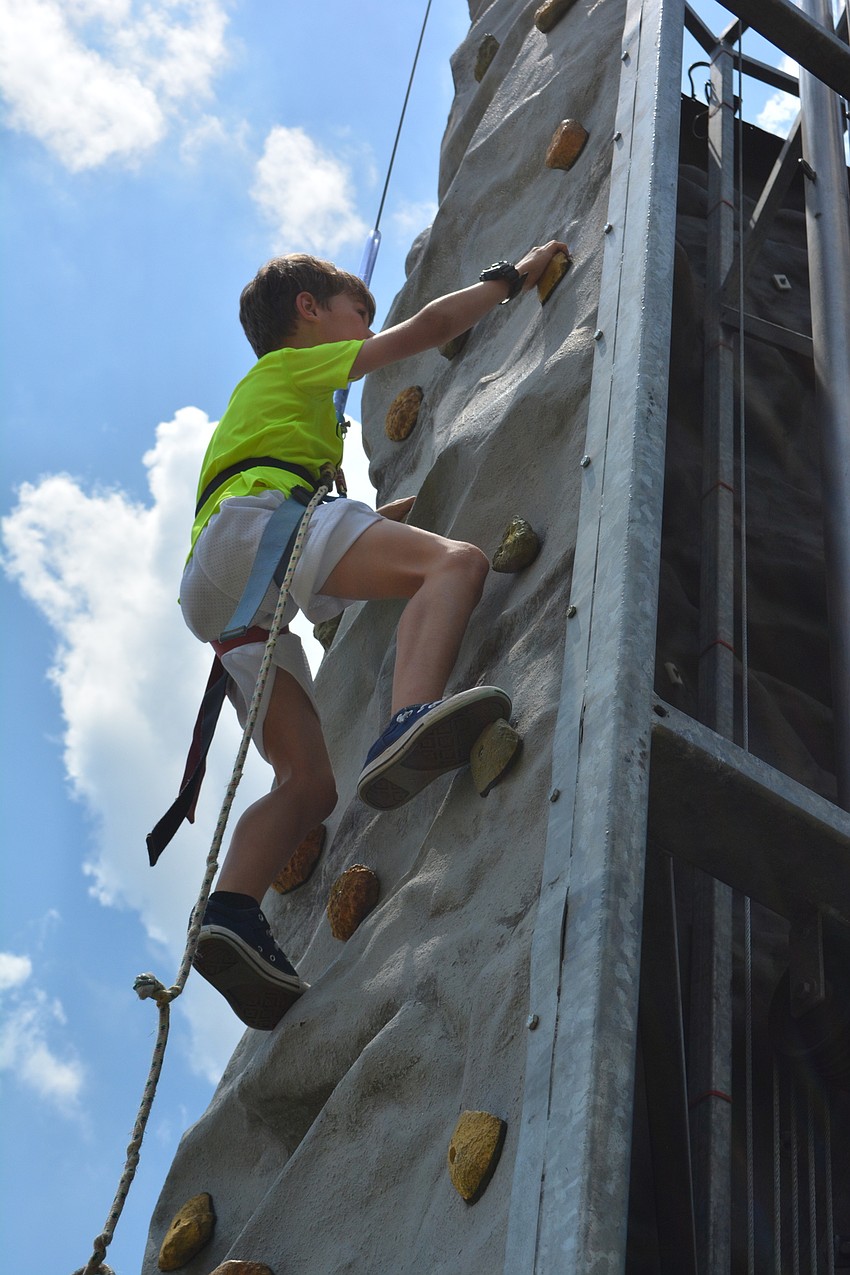 Central Park's Matthew Foster, 8, went higher than most on the rock wall.
