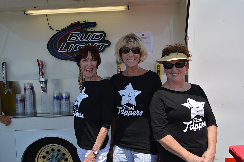 Sami Blouin, Carol Johnston and Lorraine Conlan of the Flash Tappers (of the Players Centre) help to raise money for The Players by working the beer truck.