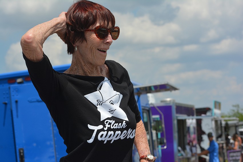 Sami Blouin entertains the crowd by dancing on a table in front of the beer truck.
