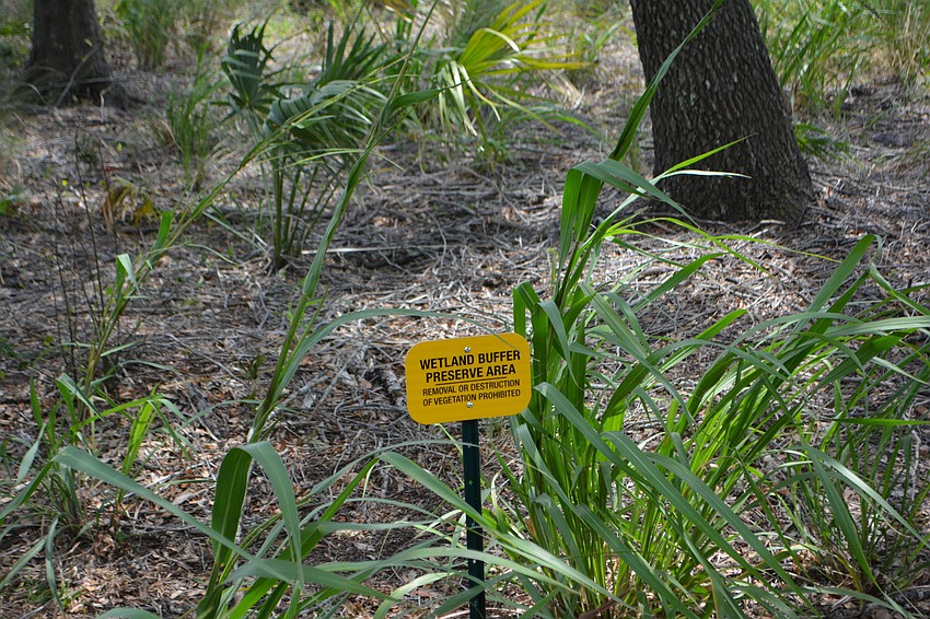 A sign warns those visiting the park that nature trumps everything else in certain spots.