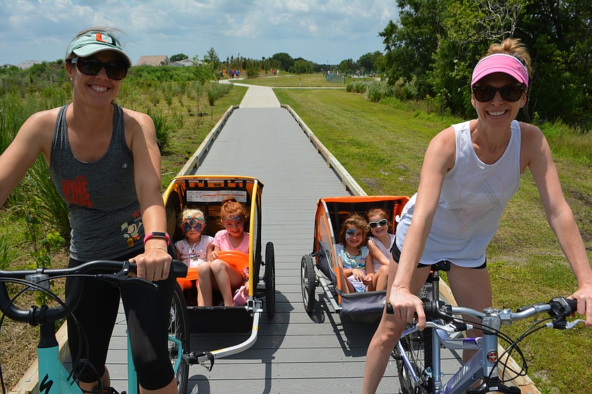 Lakewood Ranch's Crystal Oliveira and Heritage Harbour's Katie Trusz act as cab drivers for their children, Everly Trusz, 3, Julia Oliveira, 6, Emerson Trusz, 5, and Claire Oliveira, 4.
