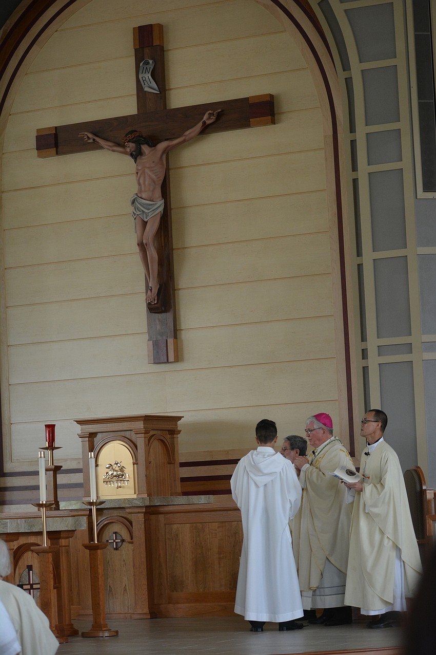 The clergy gathers for the start of the dedication service.