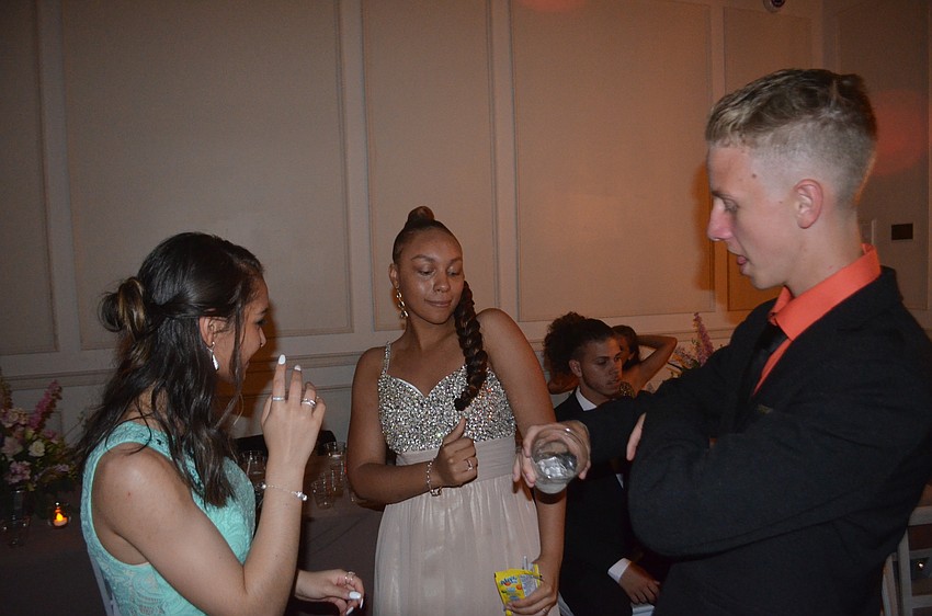 Jasmine Bautsch, Amarice Holliman and Nicholas Pederson jam out together at their prom.