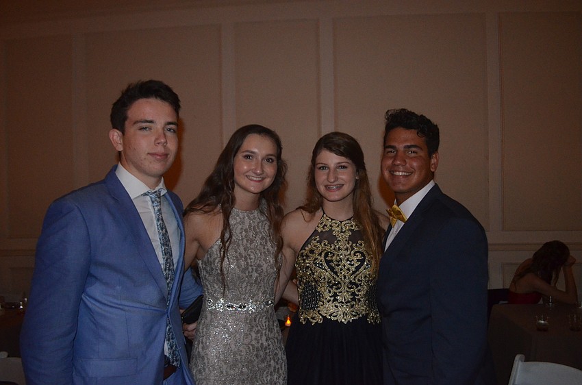 Juniors Steph Lieingsen and Brelynn Myers were urged to go to the prom by freshman Isabelle Hensley and senior Christian Lonzano,