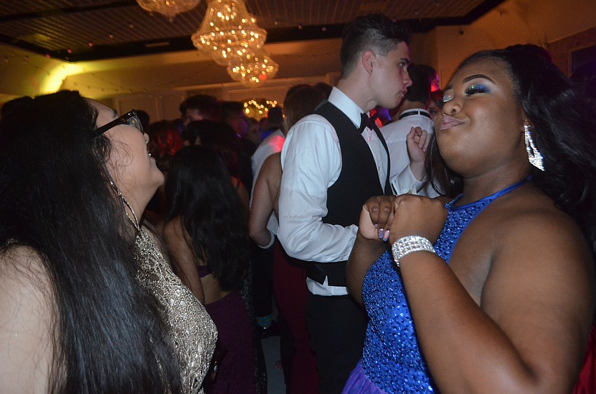 Seniors Amy Aburto and Nekyra Brown enjoy a dance at their prom.