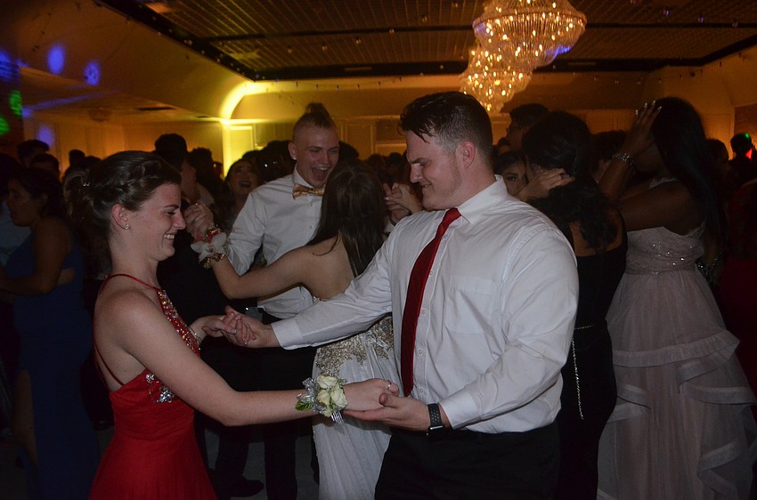 Seniors Lexi Lemmons and Rin Graves cap their final year of high school at the prom.