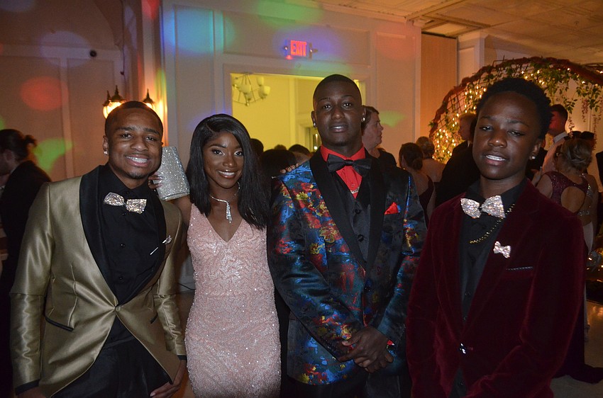 Seniors Terrell Thomas, Breanna Graham, and Jaquez Barnes and sophomore Ja'Davian Smith need a break from dancing at their prom.