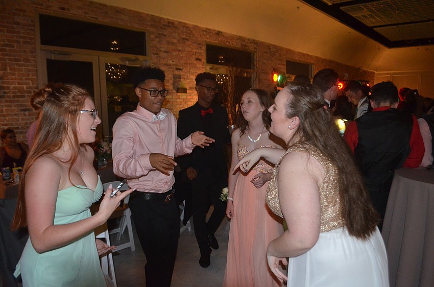 Melissa Forther, Brandon Yi and Camryn Armentrout dance during a crowd favorite song.