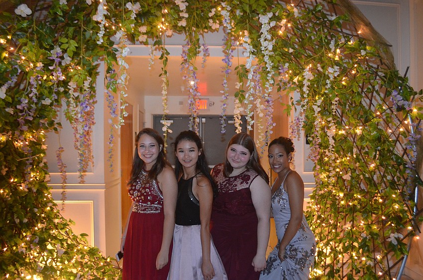 Seniors Karissa Bolles, Amanda Gillick, Yaniris Garcia and Mary Bolles spend some time under an arbor.