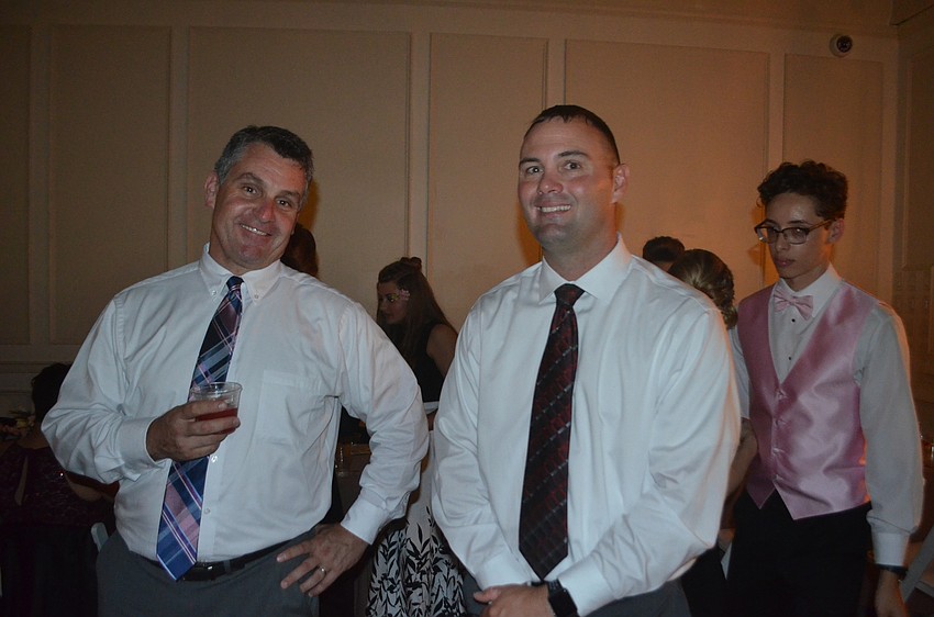 Travis Godren and Matt Whelden, assistant principals, enjoy their role supervising at the prom.