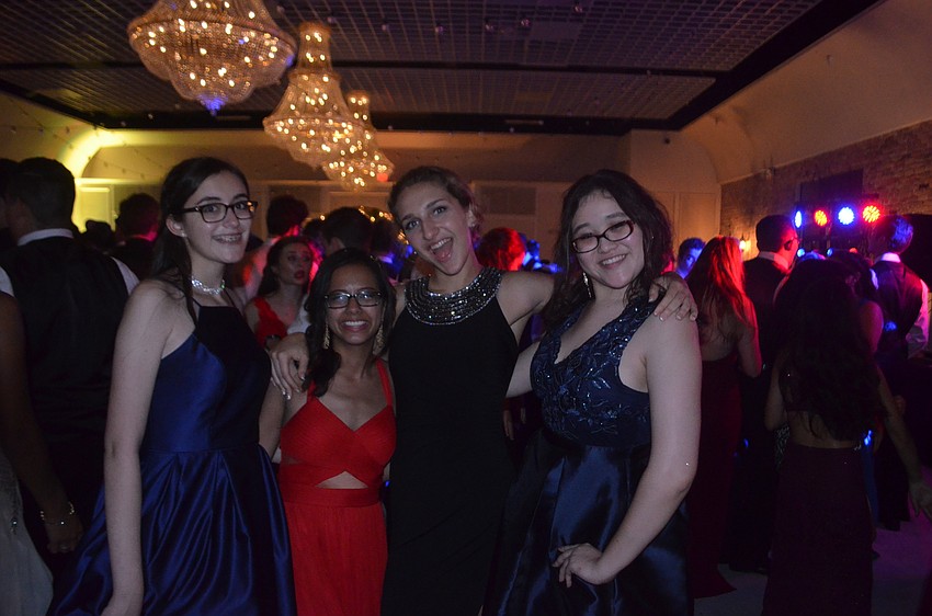 Juniors Emily Benecito, Alexa Brein, Dana Towell and Mina Quesen take a break for a photo.