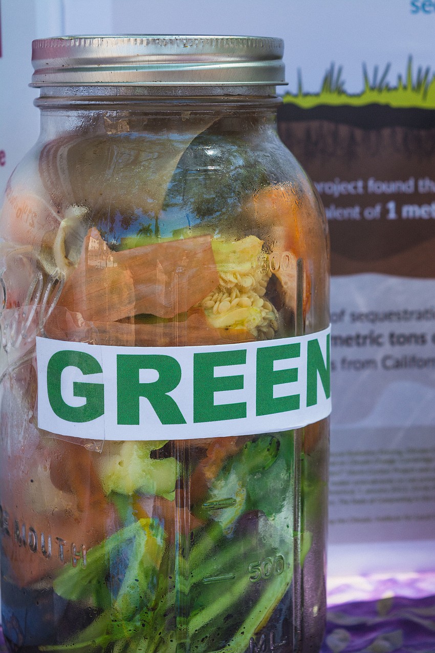A demonstration on composting highlights how to reduce waste.
