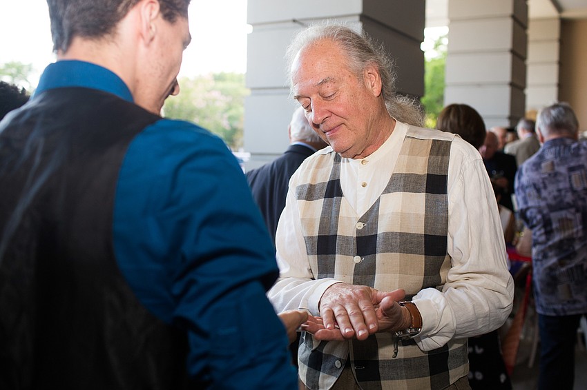 Gary Sweetman plays a magic trick.