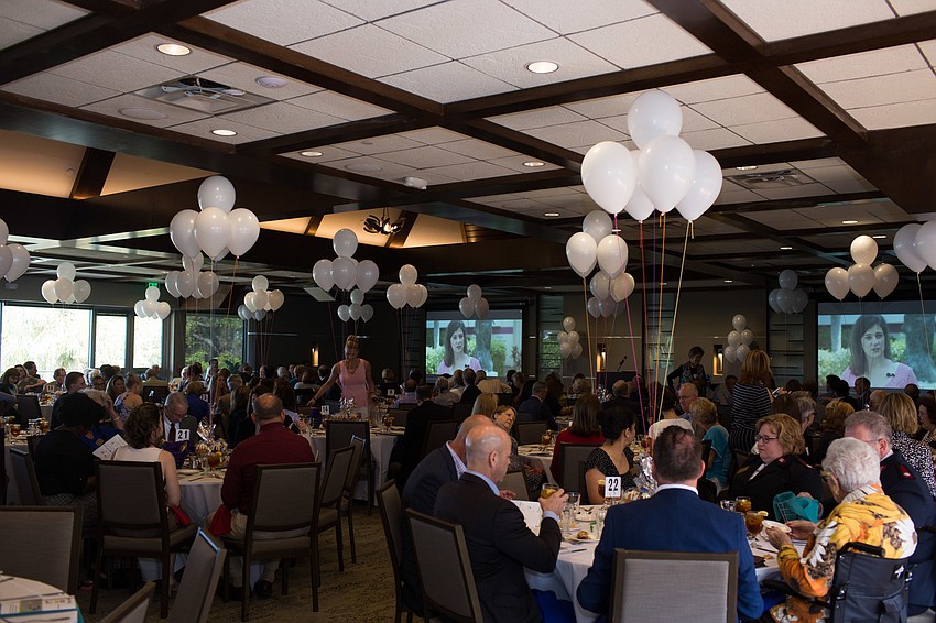 The room was decorated with balloons tied to colorful strings.