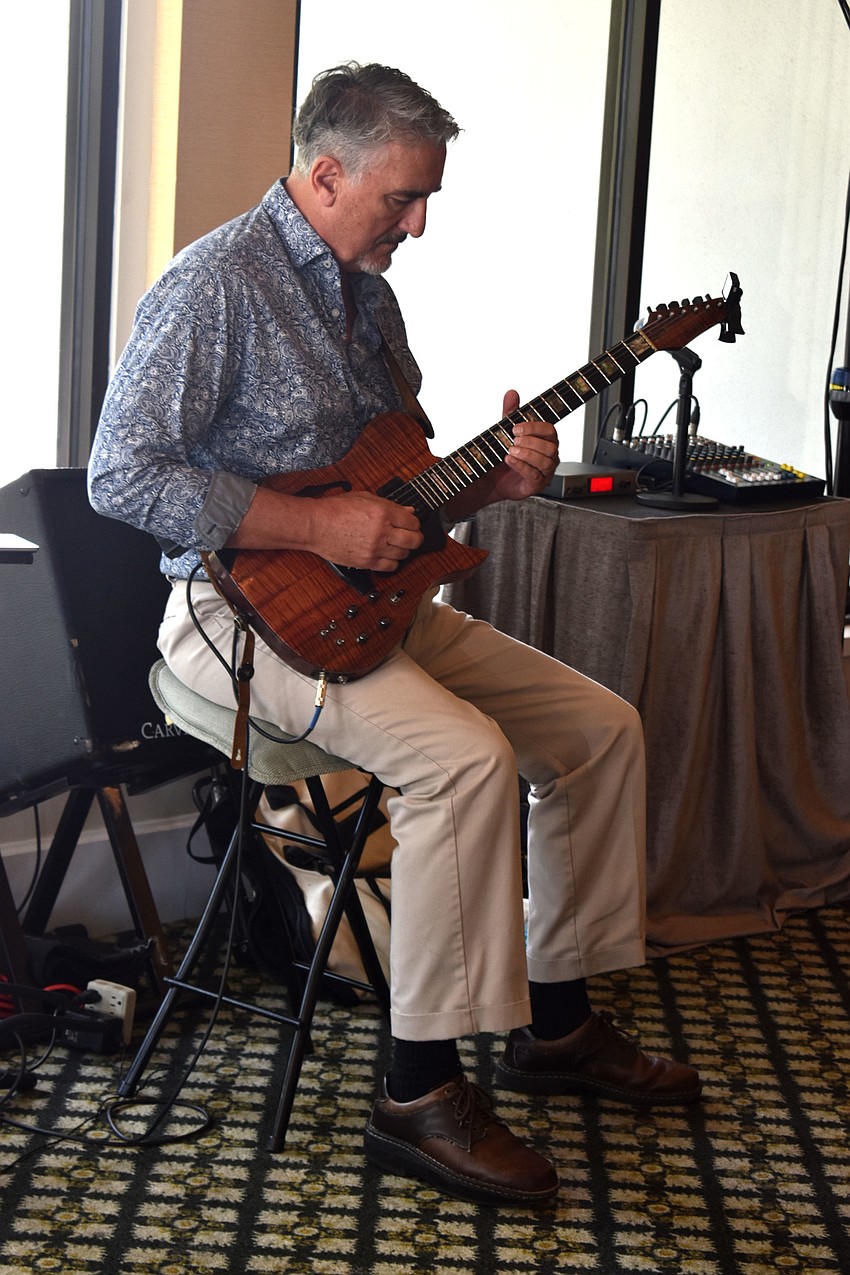 Joel Rodney Siemion performs live music during lunch.
