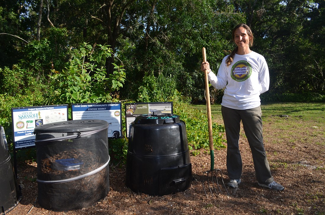 Tracie Troxler helped explain to Arlington Park visitors the composting process Tuesday evening. Troxler hopes the community composting program can continue to expand throughout the city.