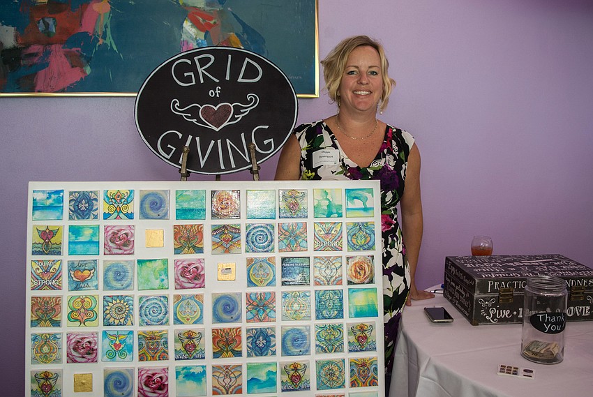 Maggie Davenport with her Grid of Giving tiles.