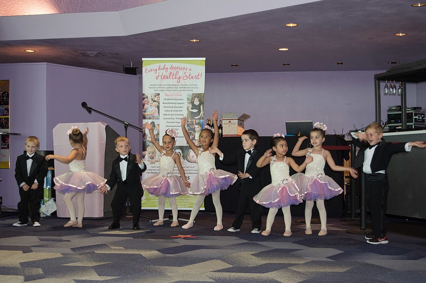Students from Stage Door Preschool of the Arts perform for the event's guests.