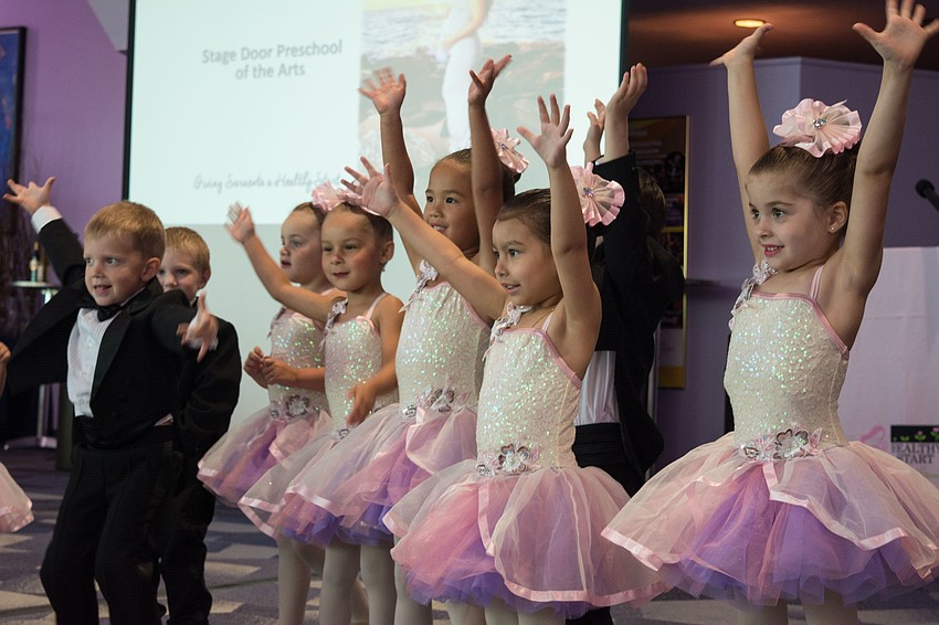 Students from Stage Door Preschool of the Arts perform for the event's guests.