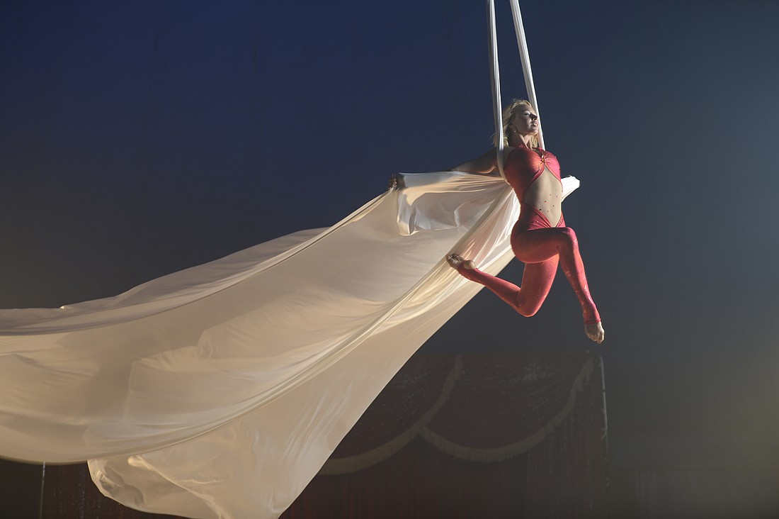 Olga Coronas will perform aerial silks and lyra routines while suspended high above the orchestra while they play. Courtesy photo