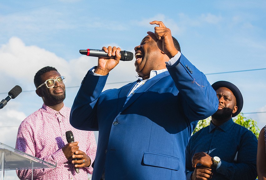 Nate Jacobs performs a song with members of the troupe to celebrate the occasion.