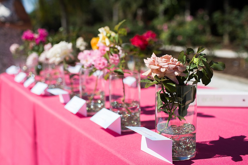 A table with each kind of rose was set up for guests to learn about them.