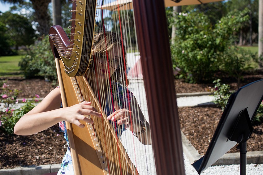 Kristen Hayos plays the harp.